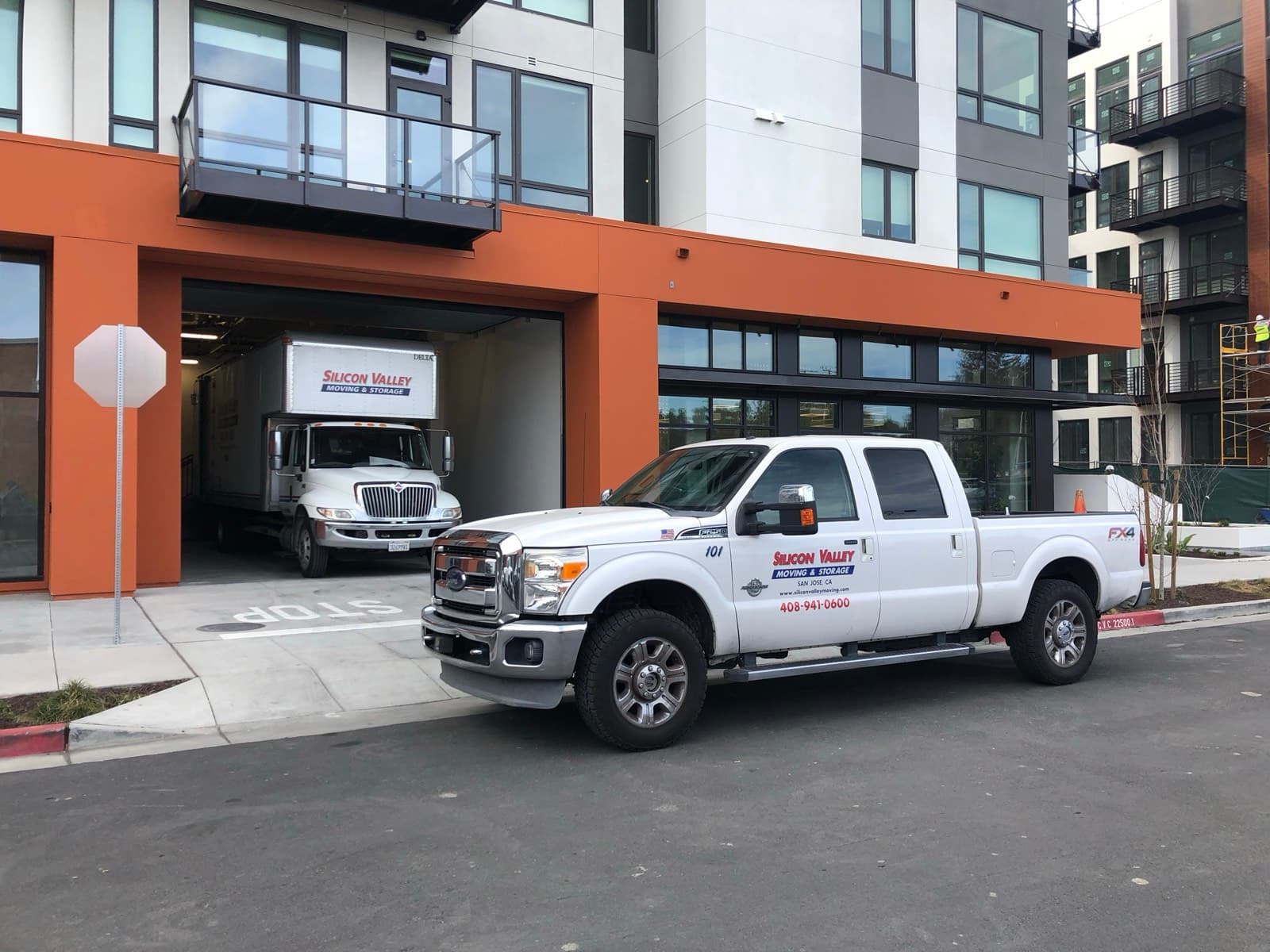 SVM moving truck backed into the parking garage of a new San Jose apartment building with an SVM pickup parked out front